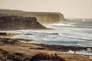 Surfers in El Cotillo coastline, Fuerteventura, Canary Islands. Spain Surfers in El Cotillo coastline, Fuerteventura, Canary Islands. Spain