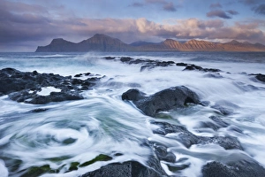 Surging waves break over the rocky shores at Gjogv on the island of Eysturoy Surging waves break over the rocky shores at Gjogv on the island of Eysturoy