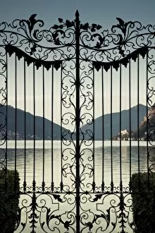 Images Dated 31st May 2009: Switzerland, Ticino, Lake Lugano, Lugano, Parco Civico gate lake view, dawn