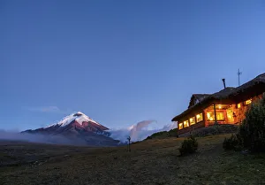 Tambopaxi Mountain Shelter and Cotopaxi Volcano at twilight, Cotopaxi National Park Tambopaxi Mountain Shelter and Cotopaxi Volcano at twilight, Cotopaxi National Park
