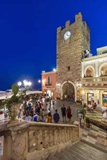Taormina, Sicily Tourists visiting the main square by night Taormina, Sicily Tourists visiting the main square by night