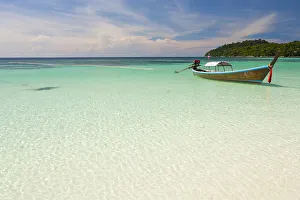 Thailand, Satun Province, Koh Lipe. A boat moored off Pattaya Beach Thailand, Satun Province, Koh Lipe. A boat moored off Pattaya Beach