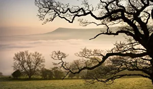 A thick blanket of early morning mist covers the landscape below Mynydd Troed in the A thick blanket of early morning mist covers the landscape below Mynydd Troed in the