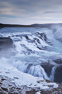 Thundering Gullfoss waterfall in winter time, Iceland, Europe. Winter (January) Thundering Gullfoss waterfall in winter time, Iceland, Europe. Winter (January)
