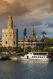 Torre del Oro watchtower with Giralda bell tower in the background, Seville, Andalusia Torre del Oro watchtower with Giralda bell tower in the background, Seville, Andalusia