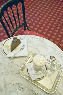Torte cake and hot Einspanner coffee, served with whipped cream at The Elisabeth Salon Torte cake and hot Einspanner coffee, served with whipped cream at The Elisabeth Salon