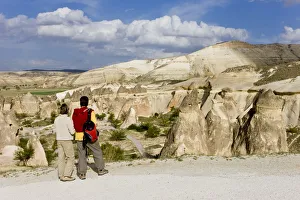Tourists looking over Volcanic tufa formations, (Fairy Chimneys), Pasabag, near Zelve Tourists looking over Volcanic tufa formations, (Fairy Chimneys), Pasabag, near Zelve