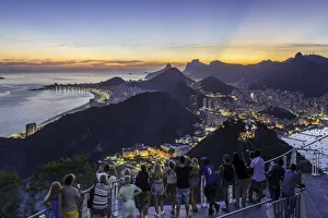 Tourists viewing Christ the Redeemer on Mount Corcovado and the city at sunset Tourists viewing Christ the Redeemer on Mount Corcovado and the city at sunset