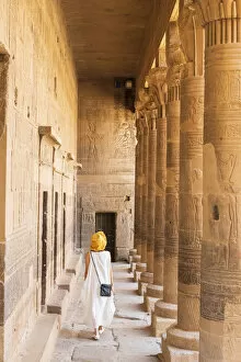 Ancient Egyptian Architecture Gallery: toursit walking through the Temple of Philae on an island in Lake Nasser, Nile River