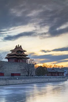 Tower and moat of Forbidden City at sunset, Beijing, China Tower and moat of Forbidden City at sunset, Beijing, China