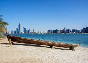 Traditional boat in the Heritage Village with city skyline in the background, Abu Dhabi Traditional boat in the Heritage Village with city skyline in the background, Abu Dhabi