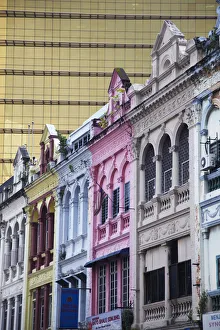 Traditional Chinese shophouses and modern skyscraper, Chinatown, Kuala Lumpur, Malaysia Traditional Chinese shophouses and modern skyscraper, Chinatown, Kuala Lumpur, Malaysia