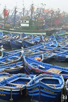 Traditional fishing boats in the busy fishing harbour of Essaouira, the third in Traditional fishing boats in the busy fishing harbour of Essaouira, the third in