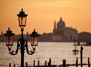 Traditional lamps and The Chiesa del Santissimo Redentore at sunset, Venice, Veneto Traditional lamps and The Chiesa del Santissimo Redentore at sunset, Venice, Veneto