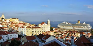 The traditional and moorish Alfama district and a cruise ship on the Tagus river. Lisbon The traditional and moorish Alfama district and a cruise ship on the Tagus river. Lisbon