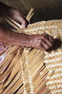 Traditional Weaving inside Longhouse (Communal House), Sarawak, Malaysian Borneo Traditional Weaving inside Longhouse (Communal House), Sarawak, Malaysian Borneo