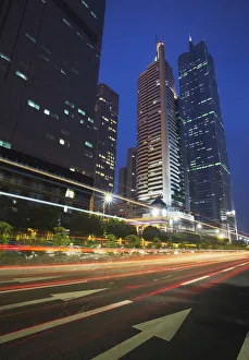Traffic passing in front of CITIC Plaza, Guangzhou, Guangdong Province, China Traffic passing in front of CITIC Plaza, Guangzhou, Guangdong Province, China