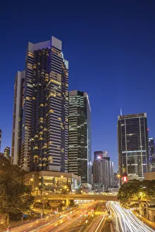 Traffic passing along street at dusk, Admiralty, Hong Kong Island, Hong Kong Traffic passing along street at dusk, Admiralty, Hong Kong Island, Hong Kong