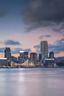 Tsim Sha Tsui skyline at sunset, Kowloon, Hong Kong Tsim Sha Tsui skyline at sunset, Kowloon, Hong Kong