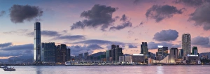 Tsim Sha Tsui and West Kowloon skyline at sunset, Kowloon, Hong Kong Tsim Sha Tsui and West Kowloon skyline at sunset, Kowloon, Hong Kong