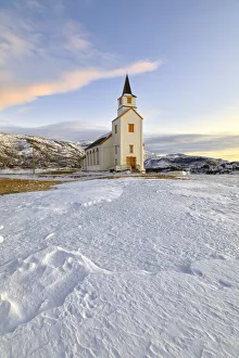 Typical church with Lyngen Alps, Mestervik, Troms county, Norway Typical church with Lyngen Alps, Mestervik, Troms county, Norway