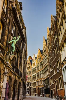 Typical road in Antwerp with old buildings and a statue, Belgium Typical road in Antwerp with old buildings and a statue, Belgium