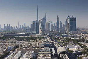 UAE, Dubai, Downtown Dubai skyline above metro rail UAE, Dubai, Downtown Dubai skyline above metro rail