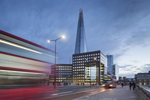 UK, London A view of The Shard from London Bridge at dusk with a tipycal London Double UK, London A view of The Shard from London Bridge at dusk with a tipycal London Double