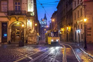 Ukraine Collection: Ukraine, Lviv, Electric Commuter Trolley, Medieval Cobblestone Streets