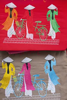Vietnam, Hanoi, Needlework on Souvenir Handbag depicting Women in Traditional Ao-dai Vietnam, Hanoi, Needlework on Souvenir Handbag depicting Women in Traditional Ao-dai