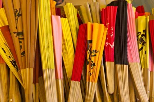 Vietnam, Mekong Delta, My Tho, Vinh Trang Pagoda, souvenir paper fans for sale Vietnam, Mekong Delta, My Tho, Vinh Trang Pagoda, souvenir paper fans for sale