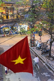 Vietnamese flag & street scene, Hanoi, Vietnam Vietnamese flag & street scene, Hanoi, Vietnam