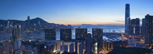 View of Hong Kong Island and Tsim Sha Tsui skylines at sunset, Hong Kong View of Hong Kong Island and Tsim Sha Tsui skylines at sunset, Hong Kong