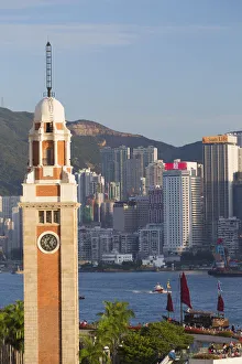 View of Former KCR clock tower and Hong Kong Island skyline, Hong Kong, China View of Former KCR clock tower and Hong Kong Island skyline, Hong Kong, China