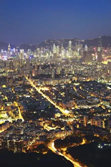View of Kowloon and Hong Kong Island from Lion Rock at dusk, Hong Kong, China View of Kowloon and Hong Kong Island from Lion Rock at dusk, Hong Kong, China