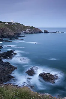 View from Lizard Point over rocky Polpeor Cove and onto the Lizard Lighthouse