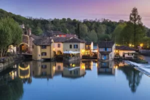 View of the medieval town of Borghetto sul Mincio at sunset
