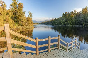 View of the peaceful Lake Matheson with the Fox glacier View of the peaceful Lake Matheson with the Fox glacier