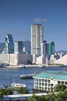 View of Tsim Sha Tsui skyline in Kowloon and Star Ferry pier, Hong Kong View of Tsim Sha Tsui skyline in Kowloon and Star Ferry pier, Hong Kong