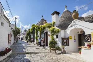 View of the typical Trulli huts and the alleys of the old village of Alberobello View of the typical Trulli huts and the alleys of the old village of Alberobello