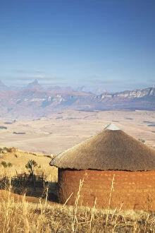 Cape Floral Region Protected Areas Gallery: Village hut with Cathedral Peak in background, Ukhahlamba-Drakensberg Park, KwaZulu-Natal