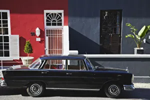 Vintage car parked outside colourful houses, Waterkant, Cape Town, Western Cape, South Vintage car parked outside colourful houses, Waterkant, Cape Town, Western Cape, South
