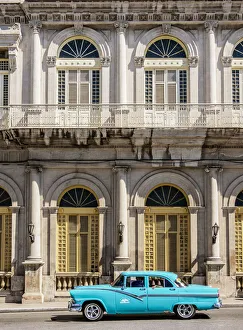 Vintage car passing in front of Casino Espanol, Libertad Square, Matanzas Vintage car passing in front of Casino Espanol, Libertad Square, Matanzas