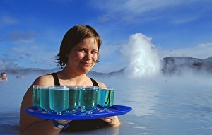 Waitress serving Blue Cocktails at the Blue Lagoon thermal spa Waitress serving Blue Cocktails at the Blue Lagoon thermal spa