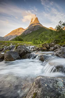 Waterfall in front of Stetinden mountain peak during midnight sun, Tysfjord, Norway Waterfall in front of Stetinden mountain peak during midnight sun, Tysfjord, Norway