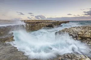 Waves of the rough sea crashing on the cliffs of Devils Bridge Caribbean Antigua Waves of the rough sea crashing on the cliffs of Devils Bridge Caribbean Antigua
