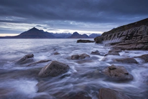 Waves rush around the rocky shores of Elgol, Isle of Skye, Scotland. Winter (December) Waves rush around the rocky shores of Elgol, Isle of Skye, Scotland. Winter (December)