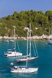 Images Dated 8th November 2013: Western Europe, Greece, Ionian Islands, Paxos. Yachts leaving the harbour at Lakka