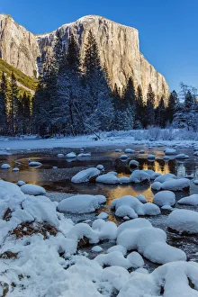 Winter landscape with iced river and El Capitan mountain behind, Yosemite National Park Winter landscape with iced river and El Capitan mountain behind, Yosemite National Park