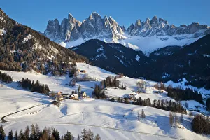 Winter landscape of St. Magdalena village and church, Geisler Spitzen (3060m), Val Winter landscape of St. Magdalena village and church, Geisler Spitzen (3060m), Val